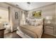 Comfortable bedroom features a neutral palette, patterned wallpaper, two windows, and an inviting king size bed at 1129 Cordia Nw Ave, Atlanta, GA 30318