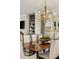 Spacious dining room with elegant chandelier, formal seating, and built-in shelving at 1129 Cordia Nw Ave, Atlanta, GA 30318
