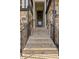 A stone staircase leads to the front door of this home, framed by matching stone walls at 1129 Cordia Nw Ave, Atlanta, GA 30318