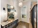 Bright foyer featuring decorative mirror, elegant lighting, and a view to the outside at 1129 Cordia Nw Ave, Atlanta, GA 30318