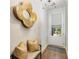 Bright foyer with wood floors, flower mirror decor, bench seating, and front door with window at 1129 Cordia Nw Ave, Atlanta, GA 30318