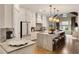 Spacious open concept kitchen featuring a large island with seating and views to the living area at 1129 Cordia Nw Ave, Atlanta, GA 30318