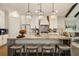 Bright kitchen featuring a large island with barstool seating, stainless appliances, and pendant lighting at 1129 Cordia Nw Ave, Atlanta, GA 30318