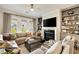Inviting living room with fireplace, built-in bookshelves, and an oversized sectional sofa at 1129 Cordia Nw Ave, Atlanta, GA 30318