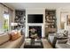 Comfortable living room with neutral tones, fireplace, bookshelves, and an open layout at 1129 Cordia Nw Ave, Atlanta, GA 30318