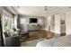 Large main bedroom with a seating area, hardwood floors, a ceiling fan, and lots of natural light at 1129 Cordia Nw Ave, Atlanta, GA 30318