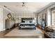 Beautiful main bedroom featuring stylish furniture, a ceiling fan, and gorgeous natural light at 1129 Cordia Nw Ave, Atlanta, GA 30318
