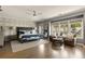 Spacious main bedroom with lots of natural light, seating area, and elegant decor at 1129 Cordia Nw Ave, Atlanta, GA 30318