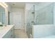 Clean bathroom with a glass shower, and a vanity with gray cabinets and white countertops at 1809 Park Land Ln, Snellville, GA 30078