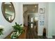 Inviting entryway featuring hardwood floors, decorative mirror, console table and serene decor, leading to the living areas at 1809 Park Land Ln, Snellville, GA 30078