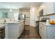 Modern kitchen featuring stainless steel appliances, granite countertops, white cabinetry, and hardwood floors at 1809 Park Land Ln, Snellville, GA 30078