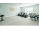 Bright living room offers neutral carpet, soothing paint color, television, and comfortable seating at 1809 Park Land Ln, Snellville, GA 30078