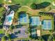 An aerial view showcases the community pool, tennis courts, playground, and golf course near the property at 3018 Bradshaw Club Dr, Woodstock, GA 30188