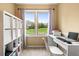 Bedroom space with a large window, built in storage, a desk and neutral colors at 3018 Bradshaw Club Dr, Woodstock, GA 30188