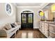 Elegant foyer featuring hardwood floors, unique architectural details and stylish decor at 3018 Bradshaw Club Dr, Woodstock, GA 30188