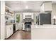 Updated kitchen with stainless steel appliances, ample storage, and tile countertops at 3018 Bradshaw Club Dr, Woodstock, GA 30188