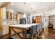Beautiful kitchen with an island and breakfast bar, complemented by a stylish sliding barn door at 3018 Bradshaw Club Dr, Woodstock, GA 30188