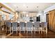 Modern kitchen featuring a large island with barstool seating and stainless steel appliances at 3018 Bradshaw Club Dr, Woodstock, GA 30188