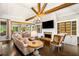 Open-concept living room with fireplace, built-in shelving, and abundant natural light at 3018 Bradshaw Club Dr, Woodstock, GA 30188