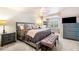 Spacious main bedroom with neutral colors, large window and sitting area at 3018 Bradshaw Club Dr, Woodstock, GA 30188