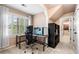 Home office featuring a computer desk, shelving and a large window with outdoor views at 3018 Bradshaw Club Dr, Woodstock, GA 30188