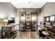 Office with black shelving, wood desk, and decorative displays at 3018 Bradshaw Club Dr, Woodstock, GA 30188