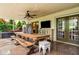 Outdoor patio with a wooden table and chairs for dining at 3018 Bradshaw Club Dr, Woodstock, GA 30188