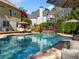 Beautiful backyard pool with lounge chairs and decorative landscaping at 3018 Bradshaw Club Dr, Woodstock, GA 30188