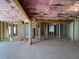 Open basement space showcasing exposed insulation, framing, and a concrete foundation, perfect for future expansion at 3063 Reserve Ct Sw, Conyers, GA 30094