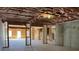Unfinished basement featuring exposed beams, insulation, and a concrete foundation awaiting customization at 3063 Reserve Ct Sw, Conyers, GA 30094