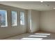Bright bedroom with three large windows letting in natural light, enhancing the room's appeal at 3063 Reserve Ct Sw, Conyers, GA 30094