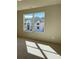 Bright bedroom with a large window overlooking a neighboring house under construction at 3063 Reserve Ct Sw, Conyers, GA 30094