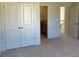 Bedroom with a full-size closet, and doorway access to a smaller room at 3063 Reserve Ct Sw, Conyers, GA 30094