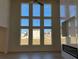 Spacious living room with large windows, fireplace, hardwood floors, and ample natural light at 3063 Reserve Ct Sw, Conyers, GA 30094