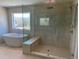 Stylish bathroom featuring a freestanding tub, glass shower, and neutral tile at 3063 Reserve Ct Sw, Conyers, GA 30094