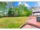 Spacious backyard with a wooden deck and gazebo, ideal for outdoor entertaining at 5147 Winding Glen Dr, Lithonia, GA 30038