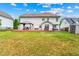 Well-maintained backyard with a two-story house, deck, gazebo, and shed at 5147 Winding Glen Dr, Lithonia, GA 30038