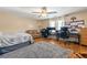 Spacious bedroom featuring bed, sofa, dual work stations and ample storage at 5147 Winding Glen Dr, Lithonia, GA 30038