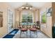 Bright breakfast nook with large windows and a cozy dining set at 5147 Winding Glen Dr, Lithonia, GA 30038