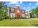 Charming brick-front home with well-maintained landscaping and attached two-car garage at 5147 Winding Glen Dr, Lithonia, GA 30038