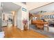Open-concept hallway with hardwood floors leading to a dining room and living area at 5147 Winding Glen Dr, Lithonia, GA 30038