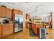 Well-equipped kitchen featuring stainless steel appliances, granite countertops, and wooden cabinetry at 5147 Winding Glen Dr, Lithonia, GA 30038