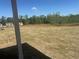 Expansive backyard with ample space and green trees on a sunny day at 157 Longhorn Way, Auburn, GA 30102