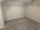 Spacious walk-in closet with neutral carpet and wire shelving for optimal organization at 157 Longhorn Way, Auburn, GA 30102
