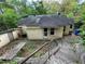 Rear view of home showing fenced-in backyard and stair access to the yard at 1604 Steele Nw Dr, Atlanta, GA 30309