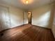 Bedroom with dark hardwood floors, basic lighting and closet at 1604 Steele Nw Dr, Atlanta, GA 30309