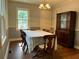 Traditional dining room with hardwood floors, natural light, and classic wooden furniture at 1604 Steele Nw Dr, Atlanta, GA 30309