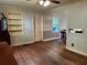Light-filled living room featuring hardwood floors, built in shelving and natural lighting at 1604 Steele Nw Dr, Atlanta, GA 30309