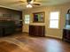 Inviting living room featuring a fireplace, hardwood floors, and plenty of natural light at 1604 Steele Nw Dr, Atlanta, GA 30309