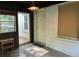 Sunroom with white brick wall, vintage lighting and outdoor access at 1604 Steele Nw Dr, Atlanta, GA 30309